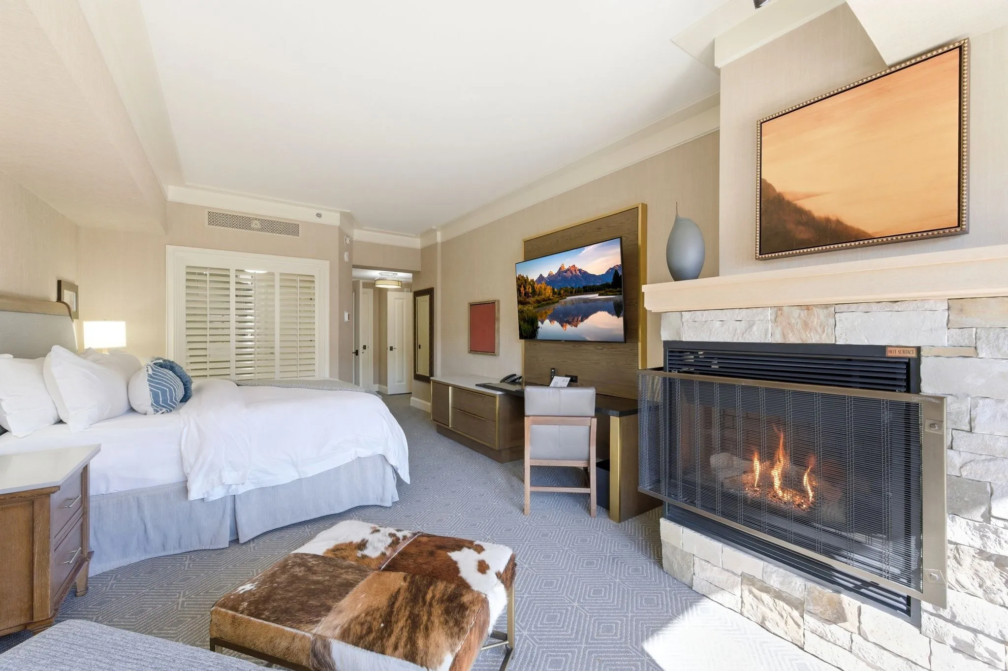 Stone-clad fireplace with a built-in firebox and decorative mantel