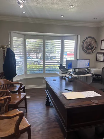 Bay window with white plantation shutters