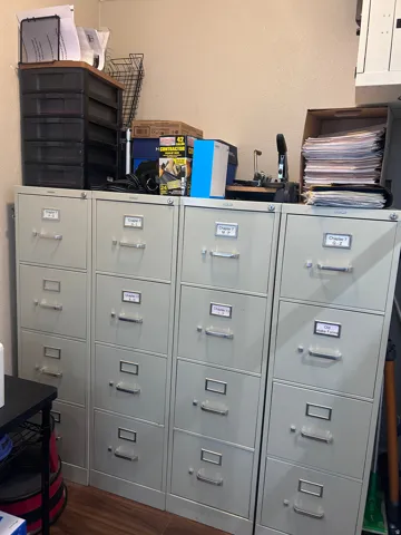 Four multi-drawer filing cabinets provide extensive storage