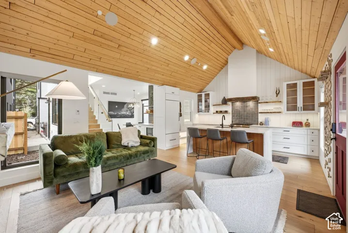 Vaulted wood-plank ceilings feature recessed lighting
