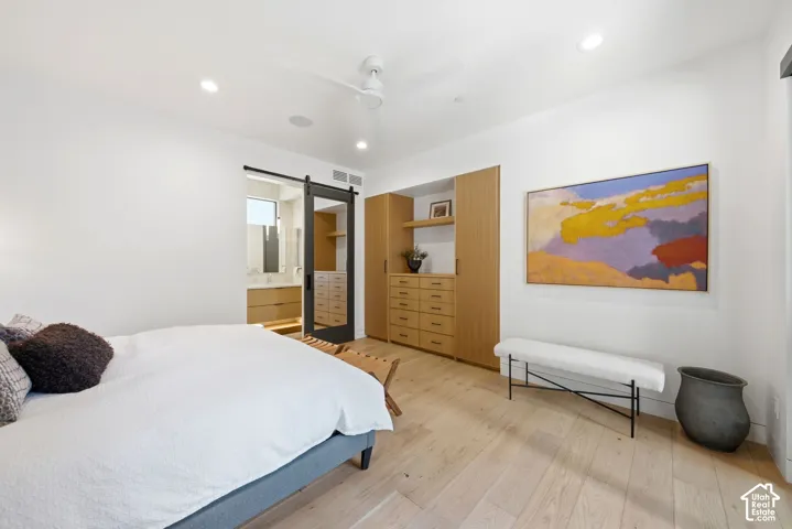 Light wood-finish flooring complements the built-in cabinetry and dresser