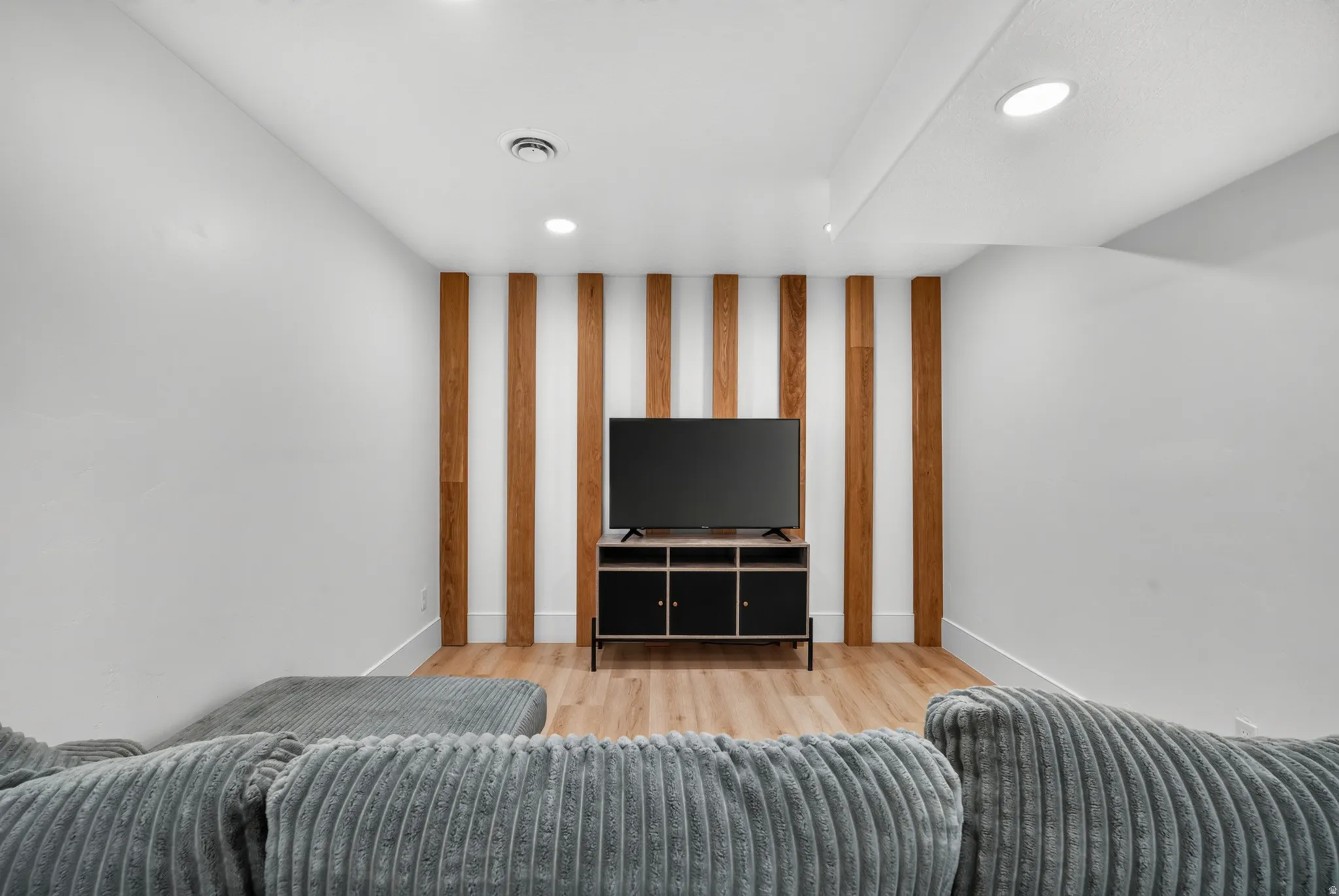 Accent wall featuring vertical wood paneling