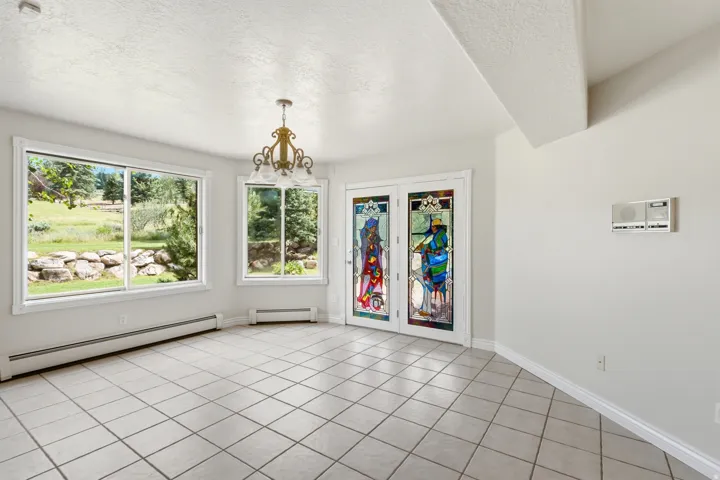 Neutral-toned tiled flooring complemented by white walls and trim