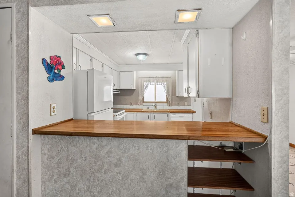 Kitchen pass-through with wood-finish countertop