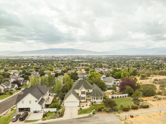 Residential neighborhood with established landscaping and mountain backdrop