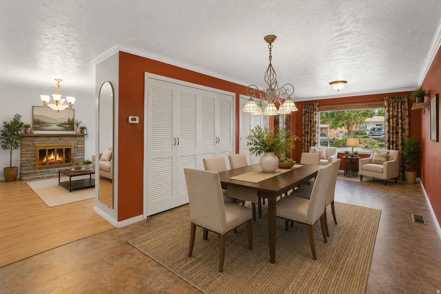 Dining area featuring a chandelier, wood-finish flooring, and white louvered bifold doors