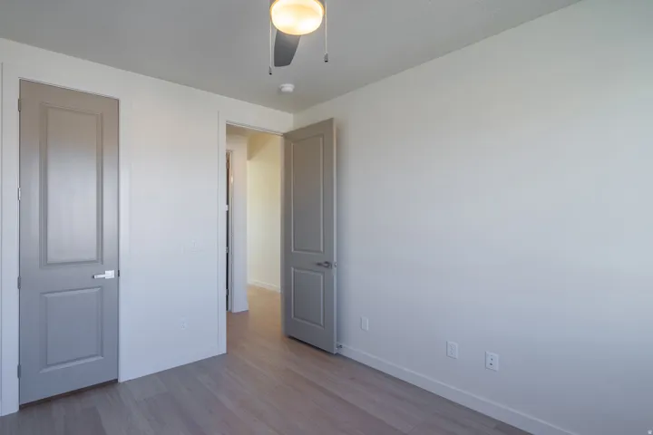 Unfurnished bedroom with light wood-style flooring and ceiling fan