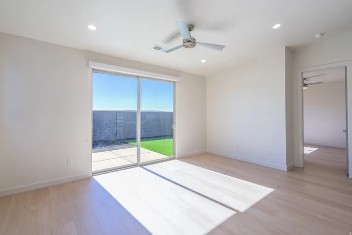 Unfurnished room featuring light wood-style floors, a ceiling fan, and recessed lighting