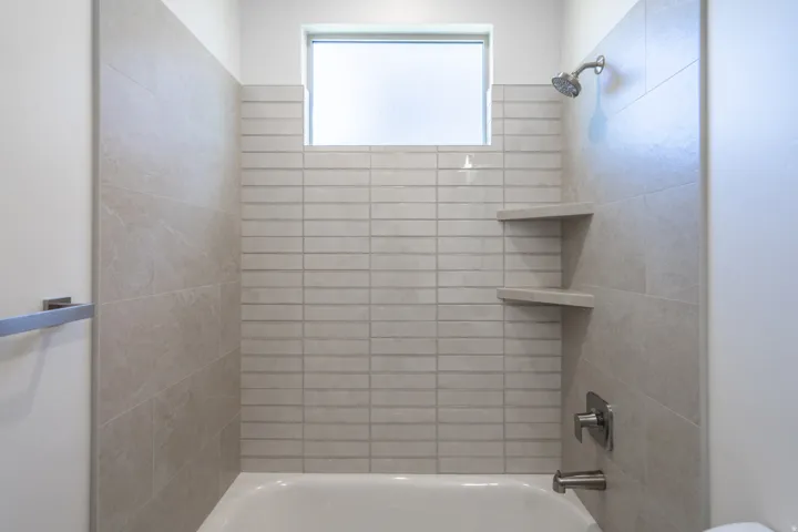 Full bath featuring bathing tub / shower combination