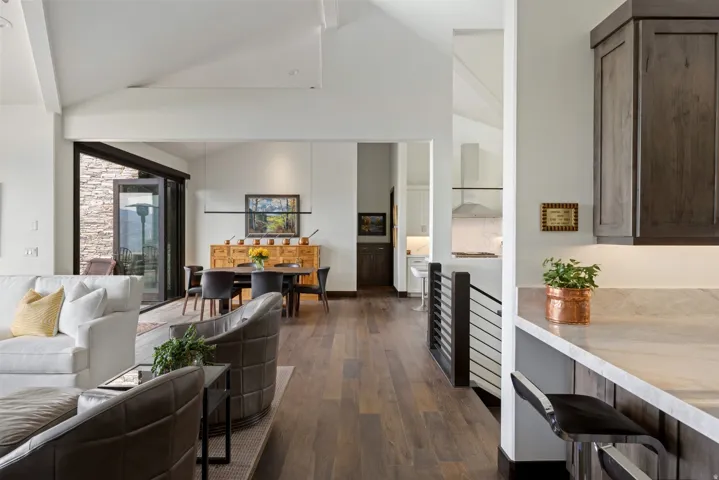Spacious interior with vaulted ceilings and wood-finish flooring