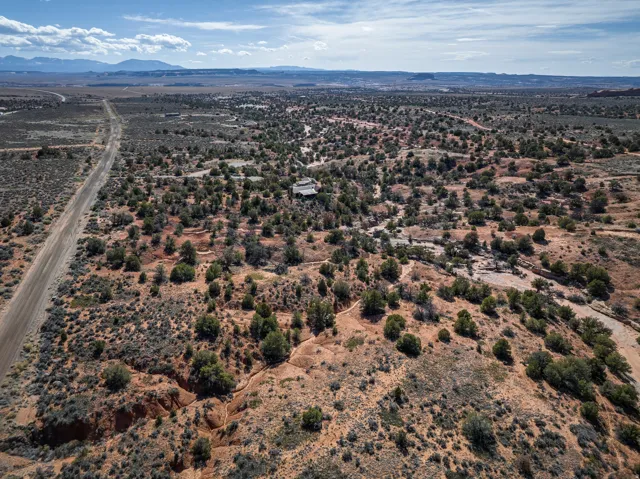 View of rural area featuring a desert landscape and a mountainous background