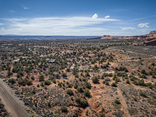 View of mountain backdrop with rural landscape and a desert landscape