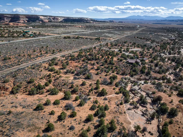 View of rural area featuring a desert landscape and a mountainous background