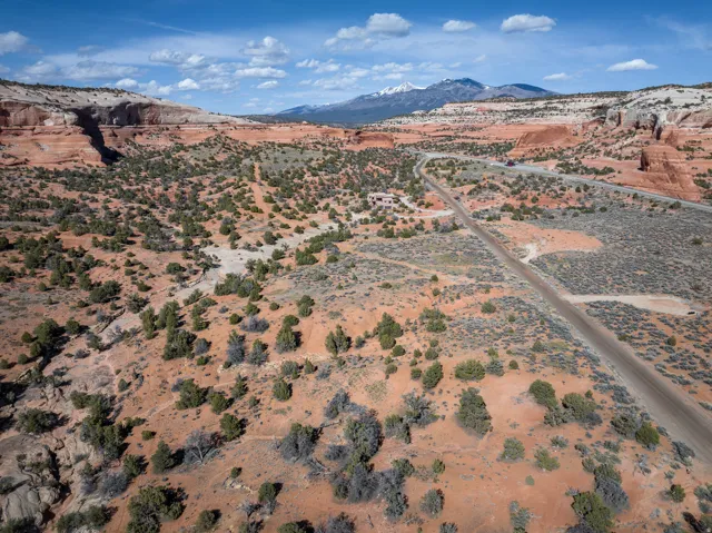 Aerial view of sparsely populated area with a desert landscape and mountains