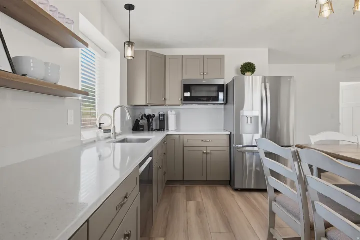 Modern kitchen with light wood-finish flooring