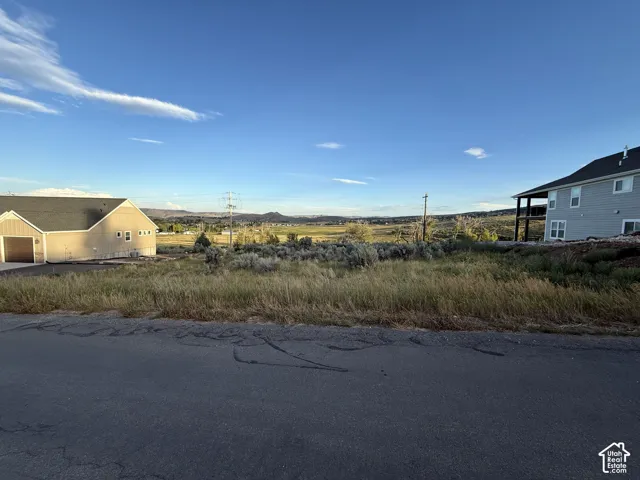 Undeveloped lot featuring native sagebrush vegetation and expansive mountain horizon