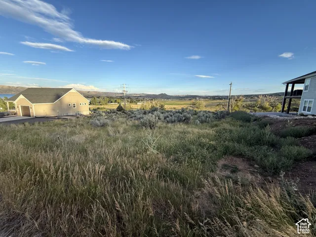 Expansive lot featuring native terrain, clear sightlines of mountainous topography, and an open horizon