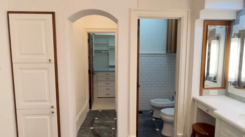 White built-in cabinetry with wood trim