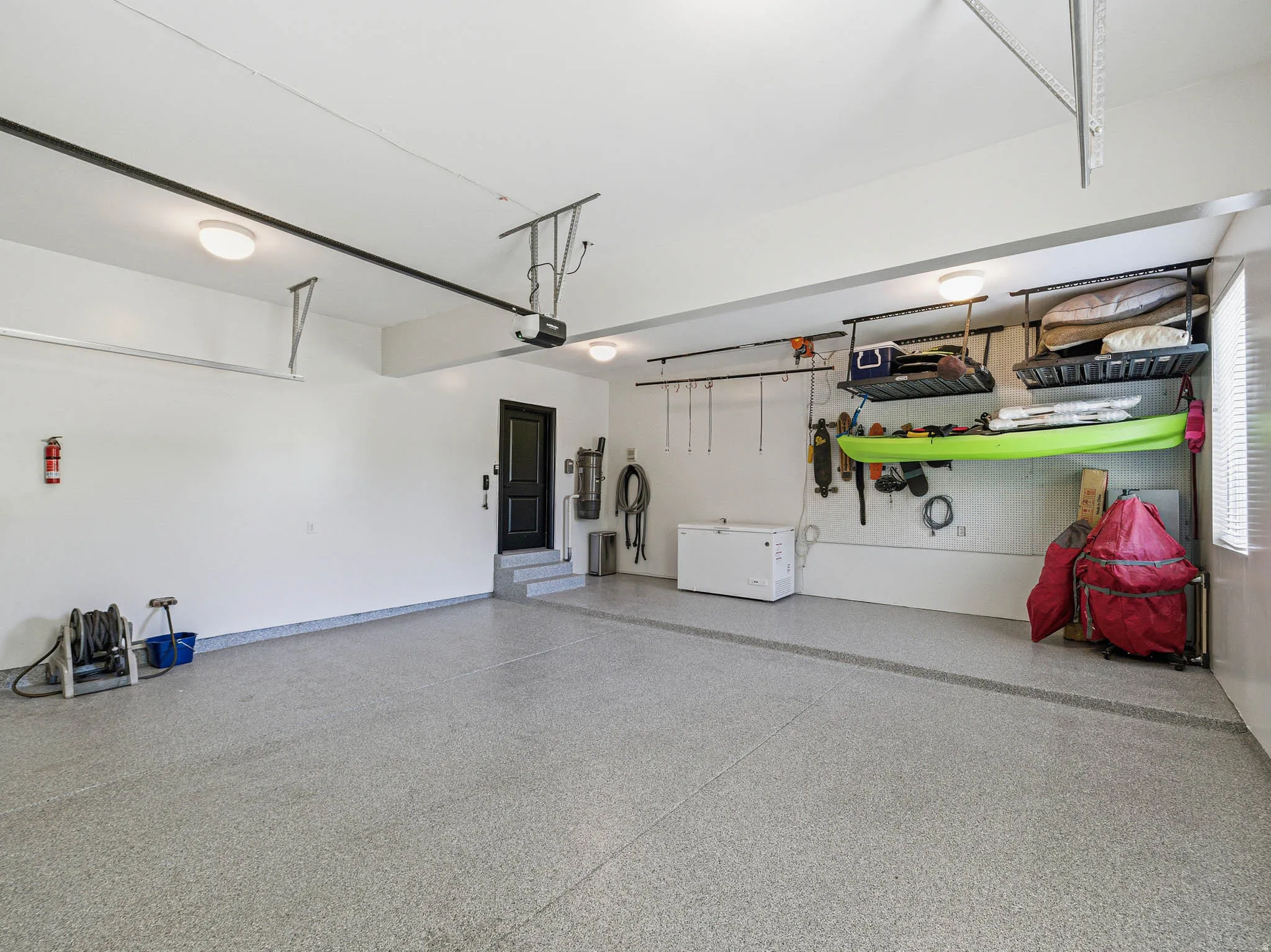 Spacious garage with light grey epoxy flooring