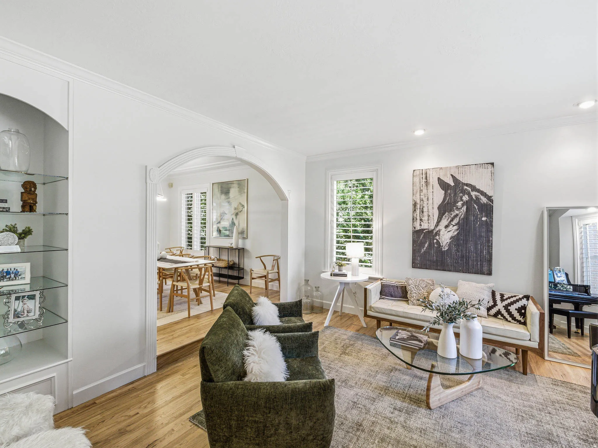 Bright living area featuring wood-finish flooring and recessed lighting