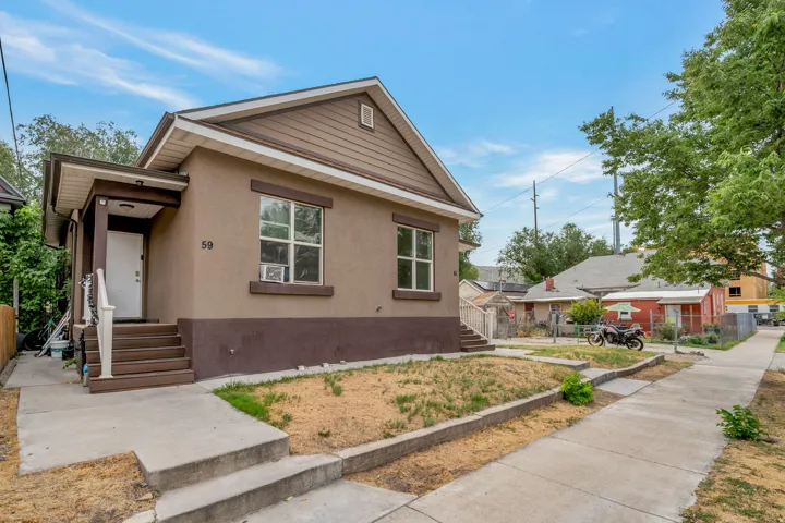 Muted brown exterior with a covered porch entry