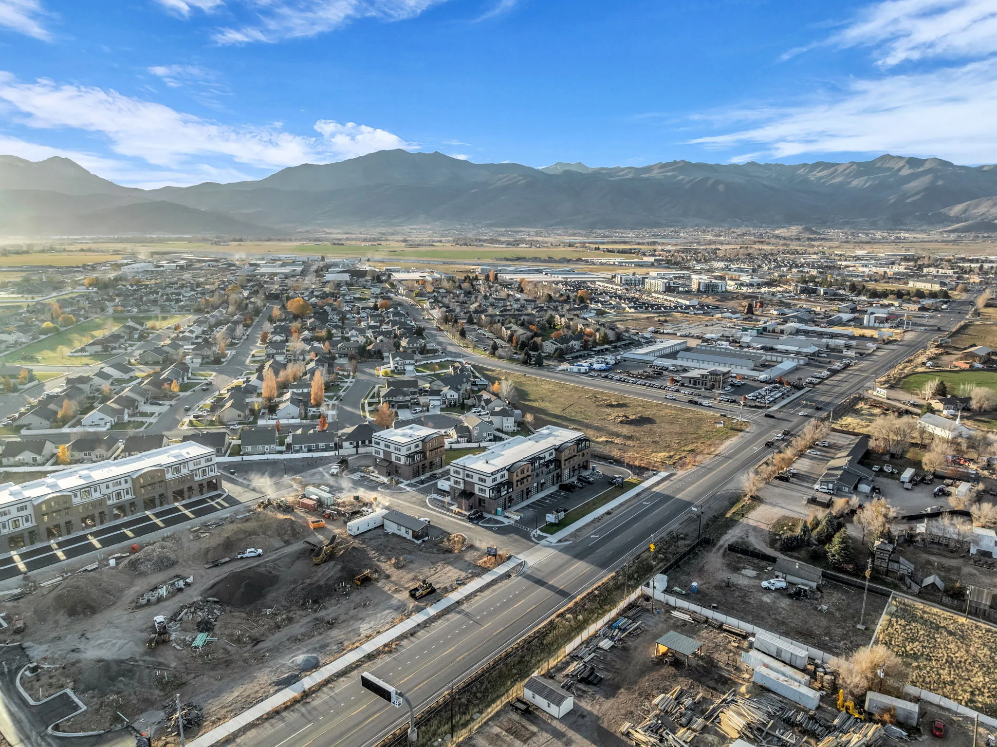 Expansive aerial landscape highlighting a developed community with established residential areas