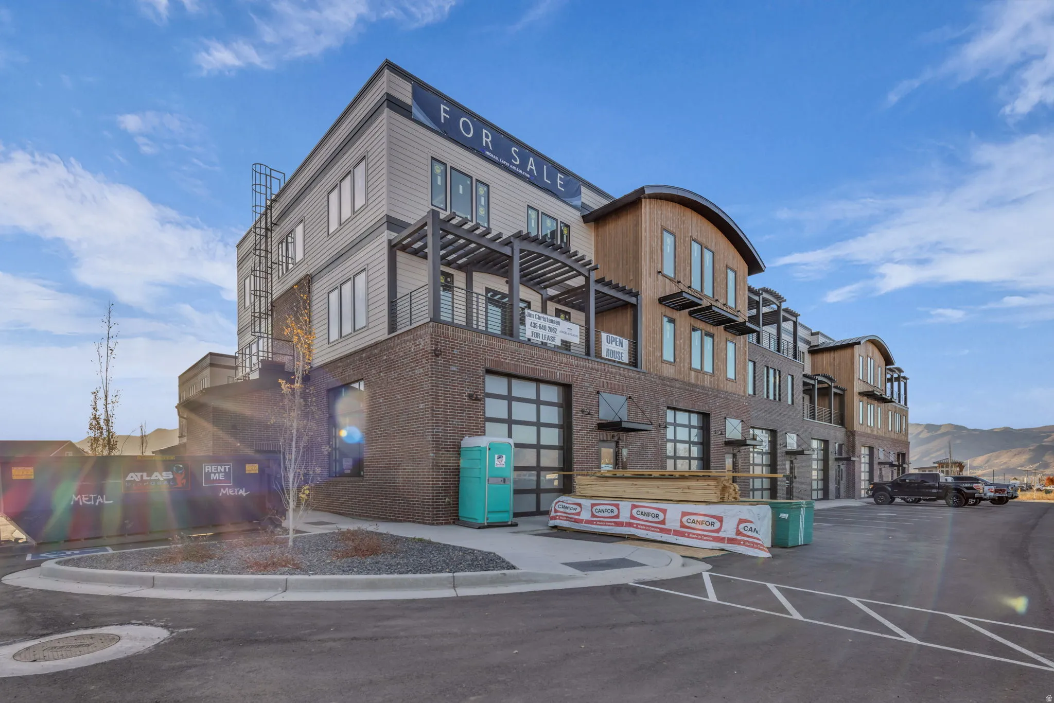 Multi-story building featuring brick and horizontal siding facades
