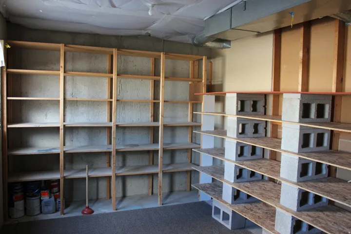 Extensive built-in shelving and concrete block storage