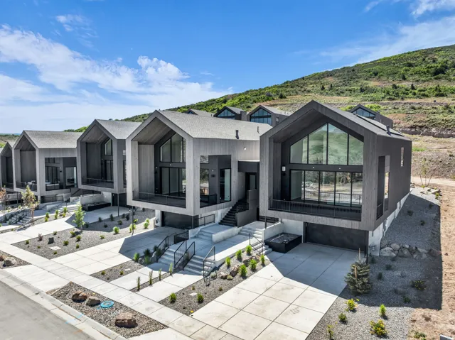 Modern architectural design featuring prominent gable roofs and large windows