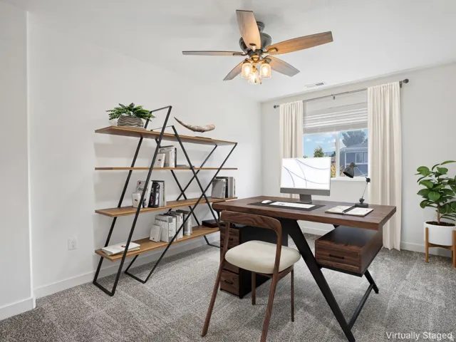 Bright room featuring a window with blinds, a ceiling fan with light fixture, and textured carpet flooring