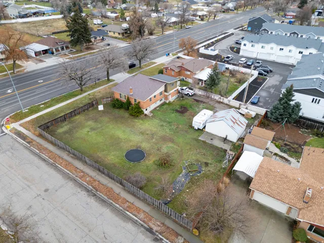 Expansive corner lot with perimeter fencing and mature trees