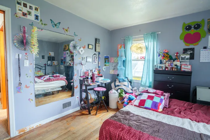 Hardwood-finish flooring features throughout this room