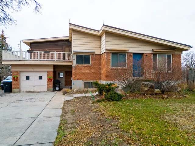 Brick and siding exterior featuring a multi-level design