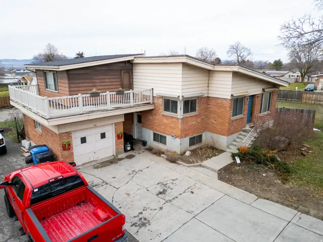 Brick and siding exterior featuring a multi-level design