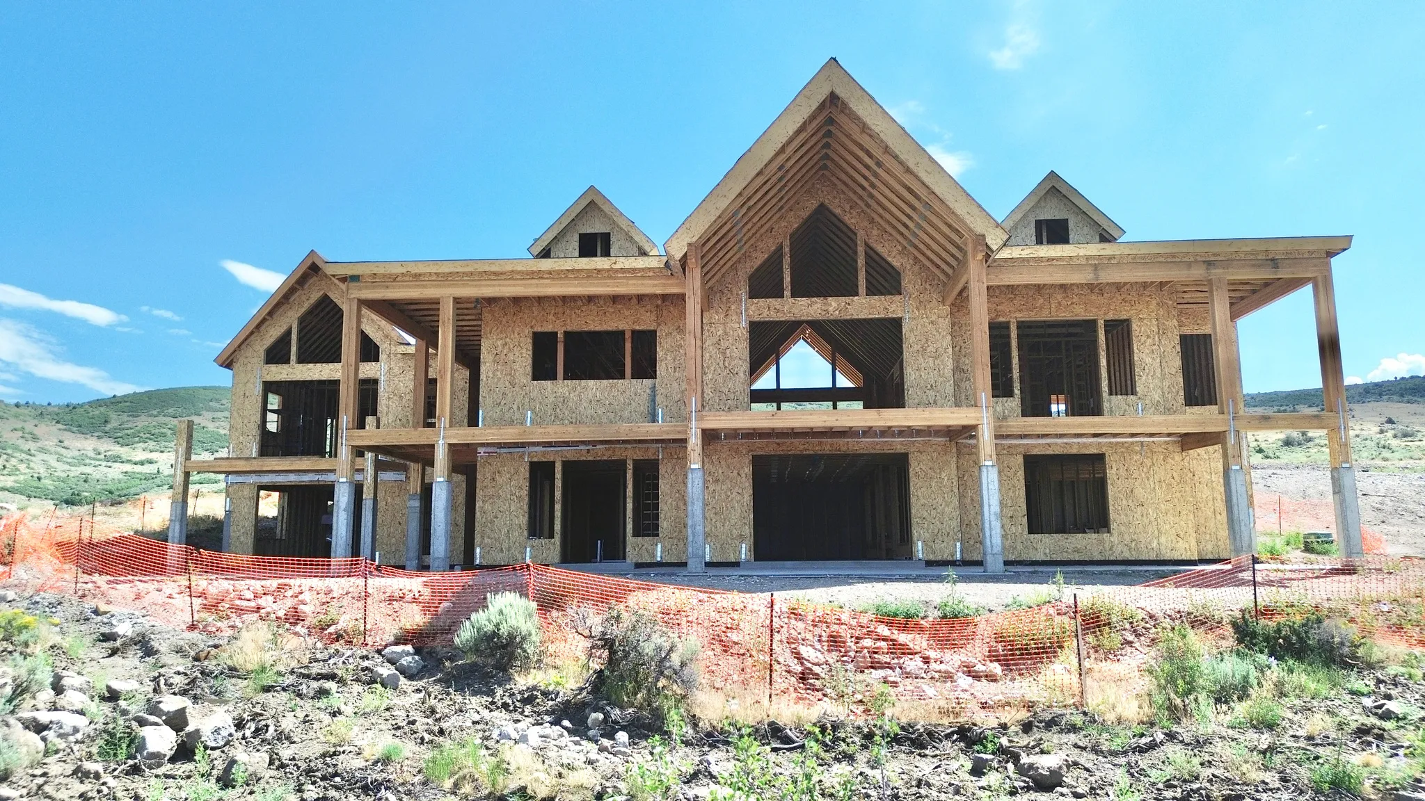 Framed structure featuring a two-story design and exposed timber framing