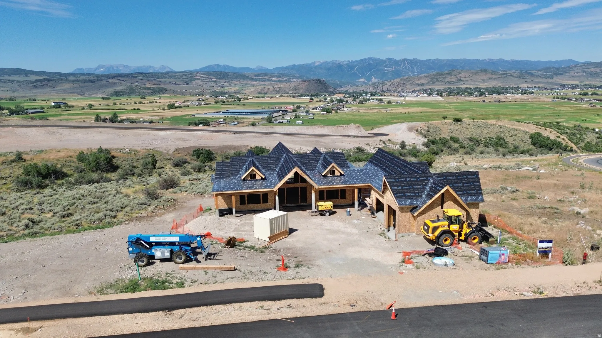 New construction residence featuring a multi-gabled roofline and framed exterior