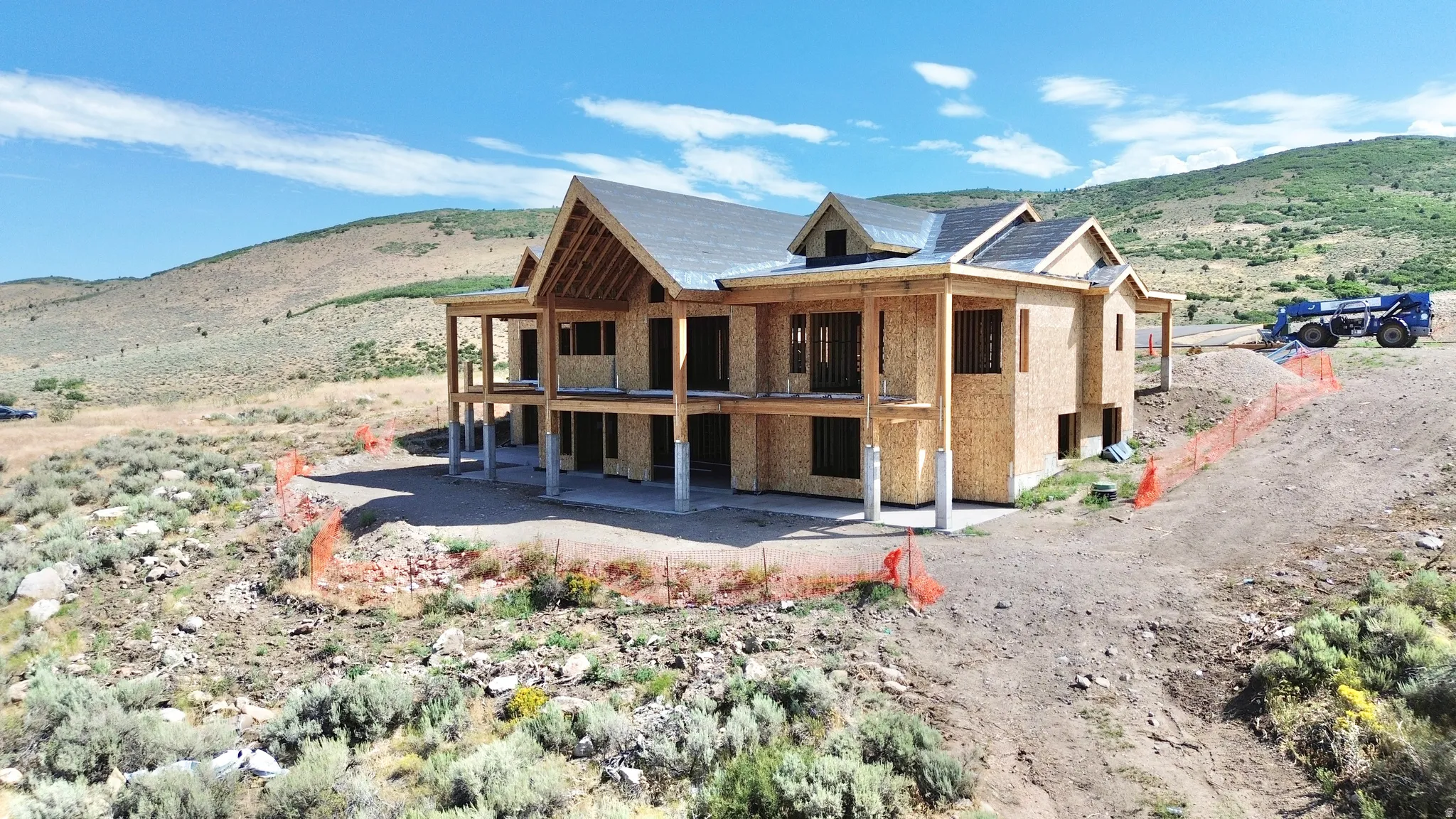 New construction residence featuring a multi-level design and a tiered roofline