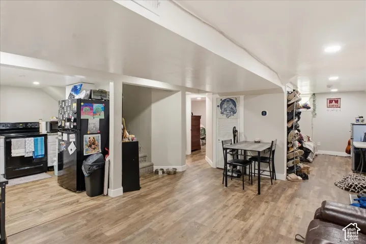 Open-concept lower level featuring wood-finish flooring throughout