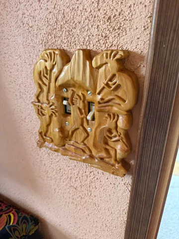 Decorative carved wood light switch plate