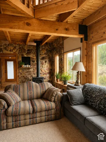 Exposed wood beams and ceiling, stone wall, wood-frame windows, wood-finish flooring in the upper level, and a black wood-burning stove