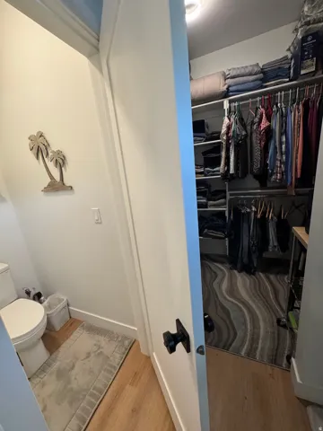 Walk-in closet featuring wire shelving and built-in storage
