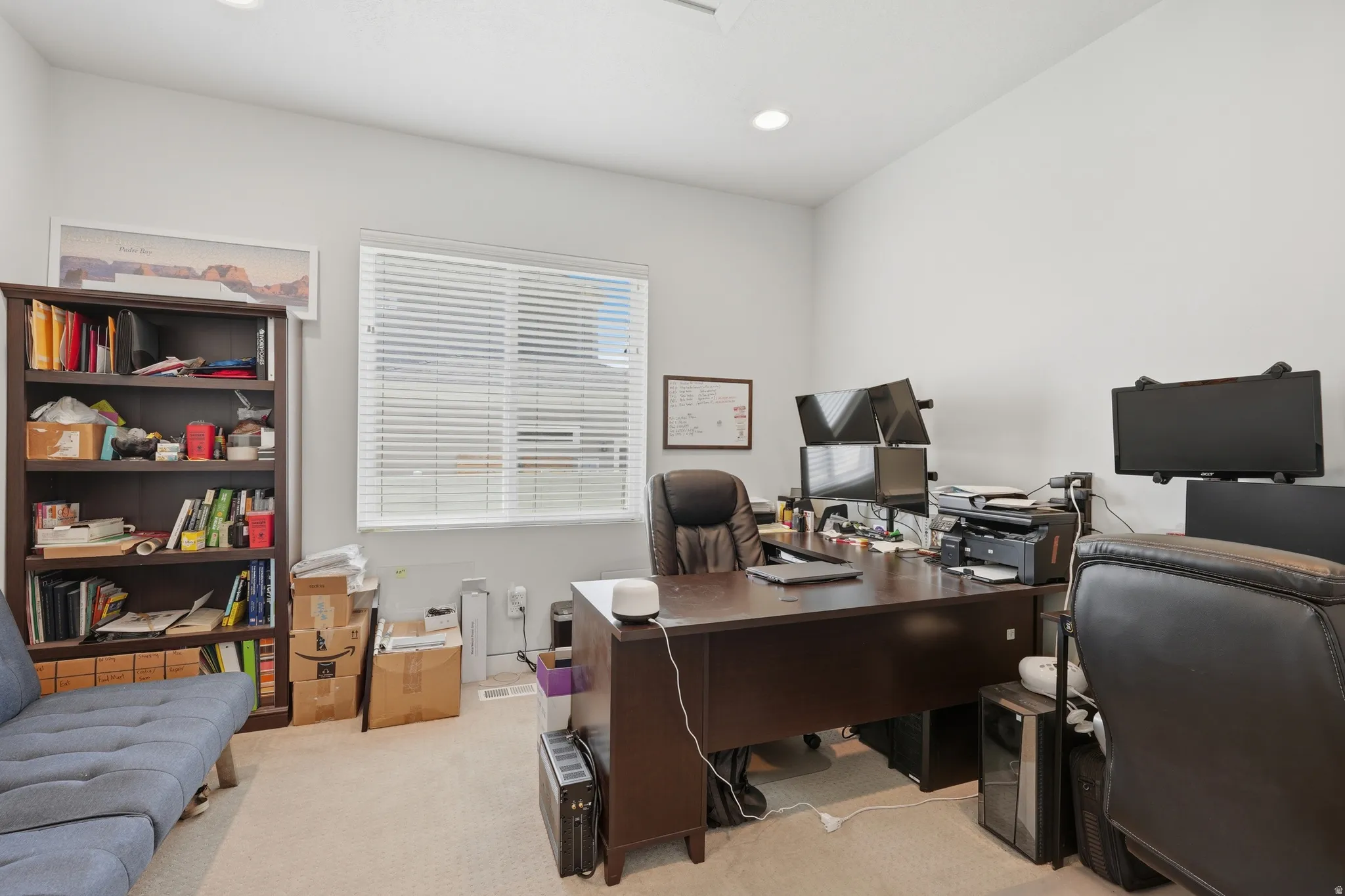 Bright room featuring neutral carpet flooring and light gray walls