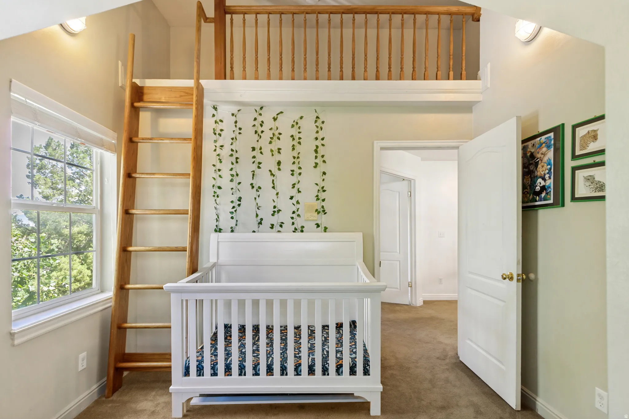 Room featuring a high ceiling, an upper loft with wood railing, and a permanent wood ladder