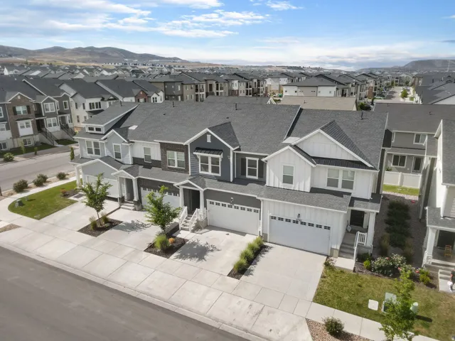 Modern townhomes featuring a contemporary architectural style with varied siding finishes