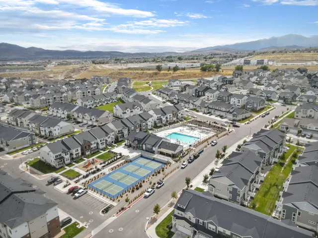 Community amenities featuring a swimming pool, covered pavilion, and multiple tennis courts