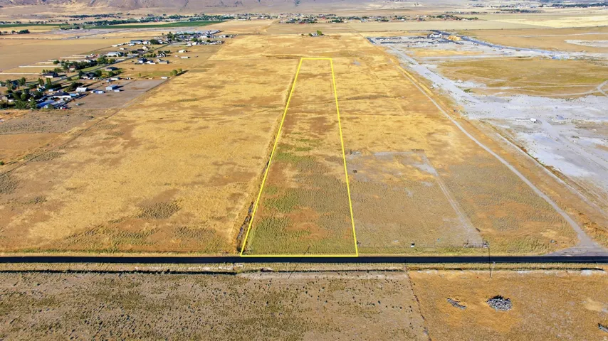 Expansive land parcel featuring a rectangular shape, defined by a yellow boundary