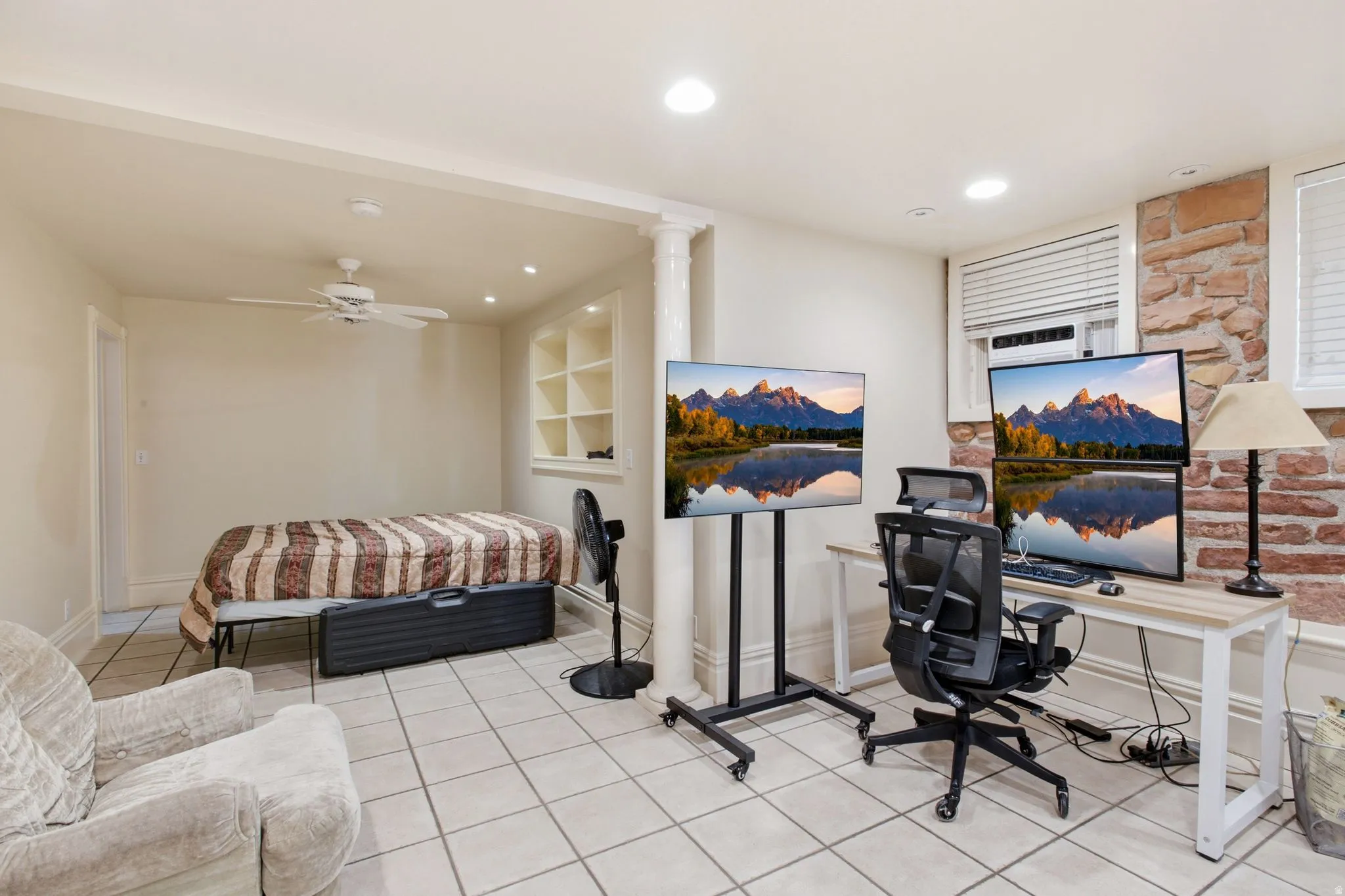 Versatile space featuring tile flooring and built-in shelving