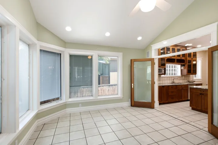 Room featuring vaulted ceilings, recessed lighting, and a ceiling fan