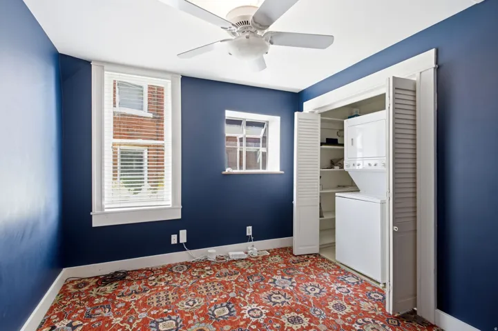 Interior space with dark blue walls and white trim
