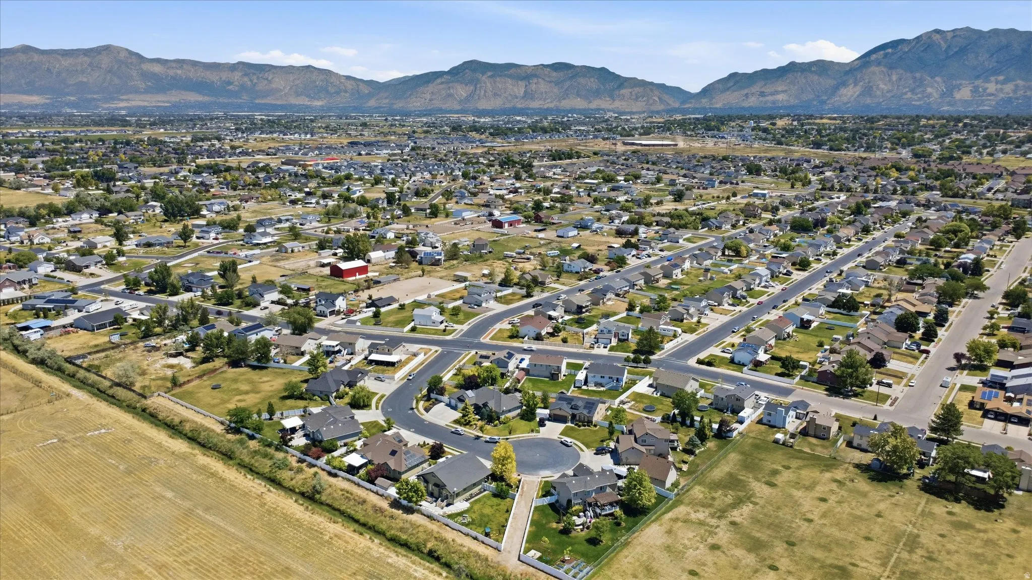 Residential community featuring a variety of single-family homes with mountain backdrops